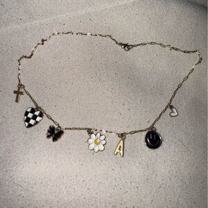 Gold Charm Necklace with Black and White Accents
